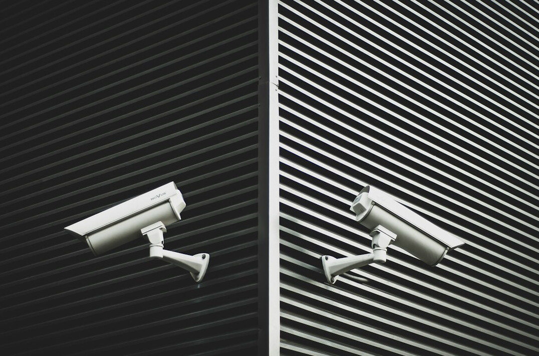 store detective watching customers